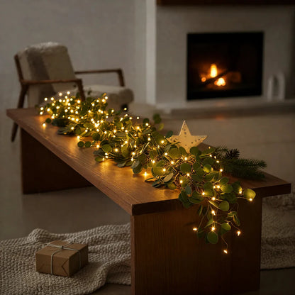 Dekoratyvinė švieselių girlianda su žalumos akcentais